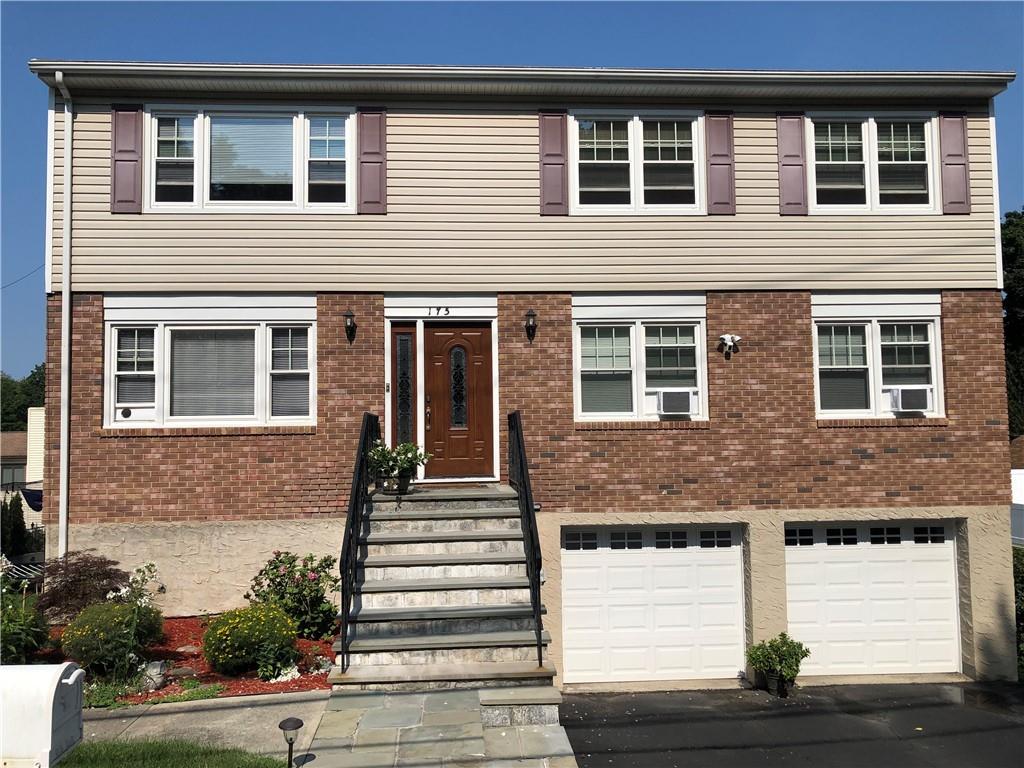 View of front of property with a garage