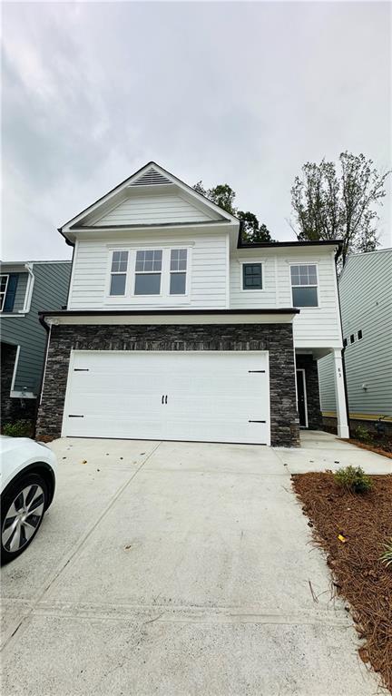 a front view of a house with garage