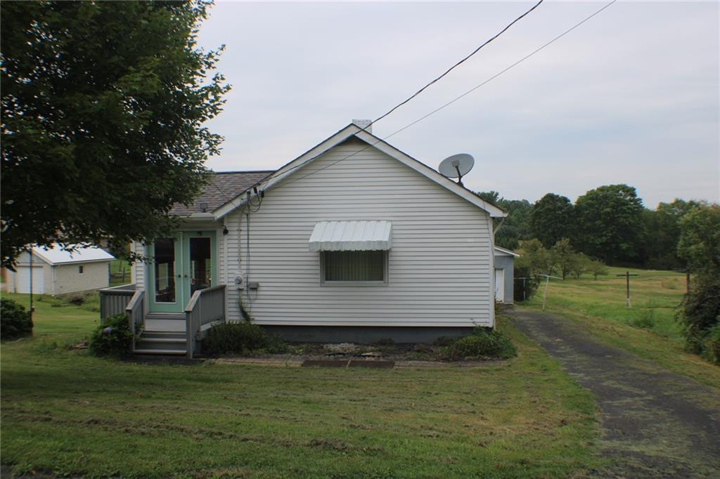 a front view of house with yard