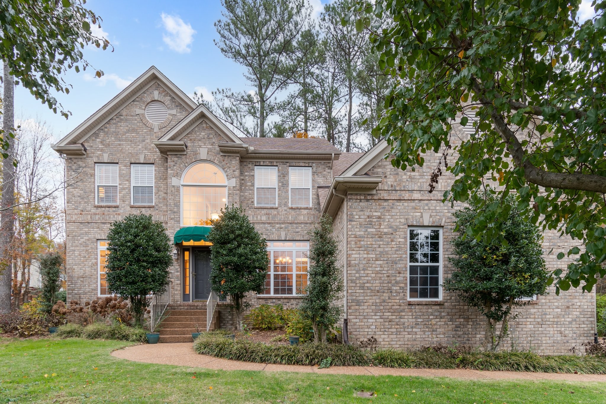 a front view of a house with a yard