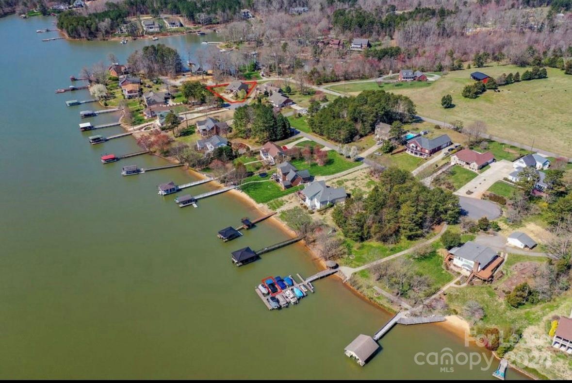 an aerial view of residential house with outdoor space and swimming pool