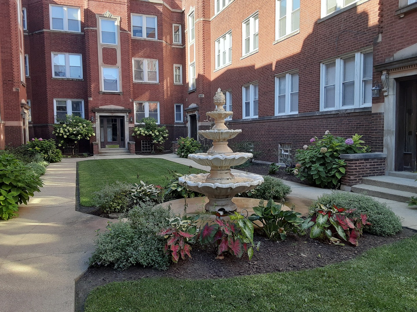 a view of a building with a garden