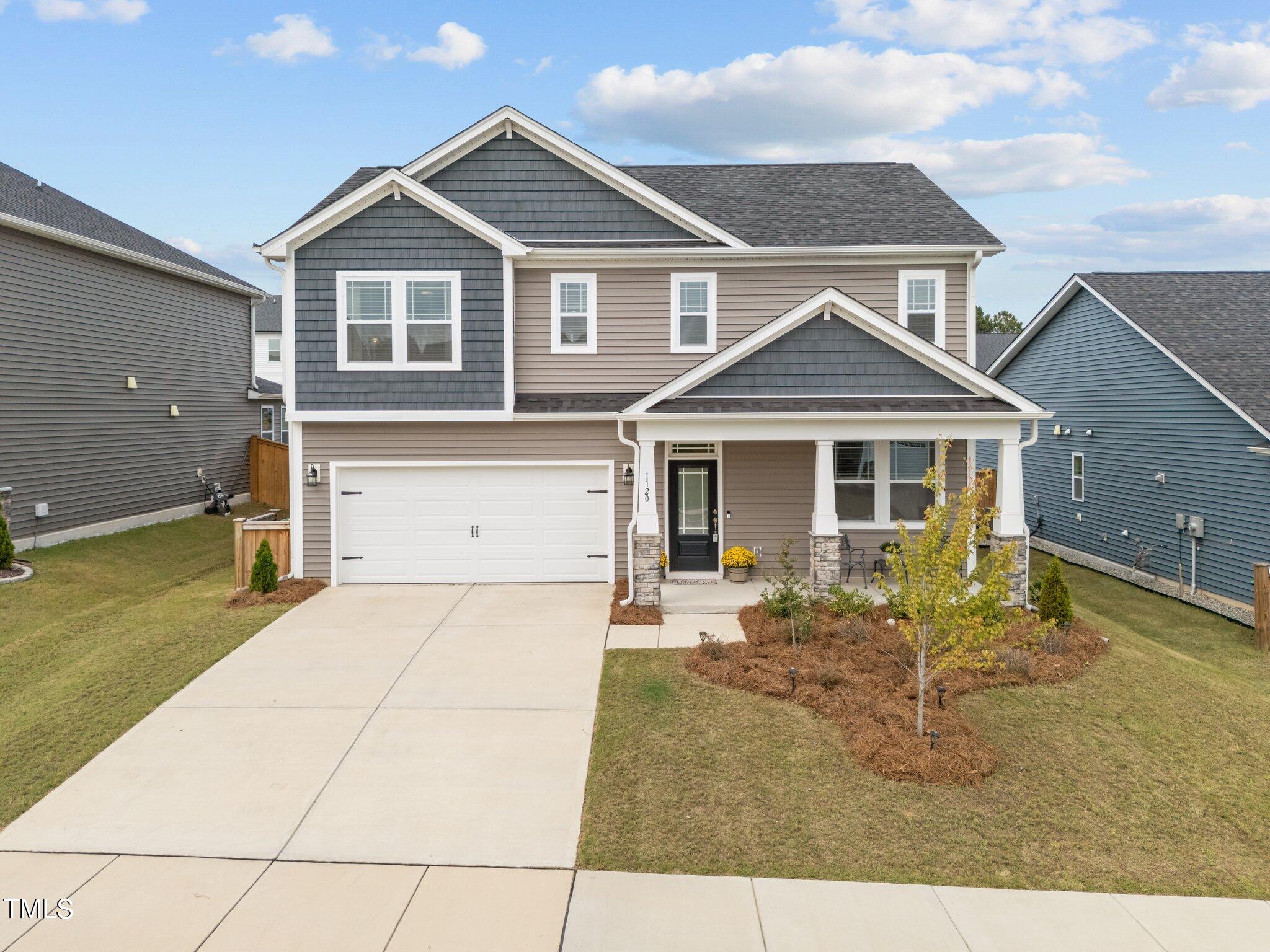 a front view of a house with a patio