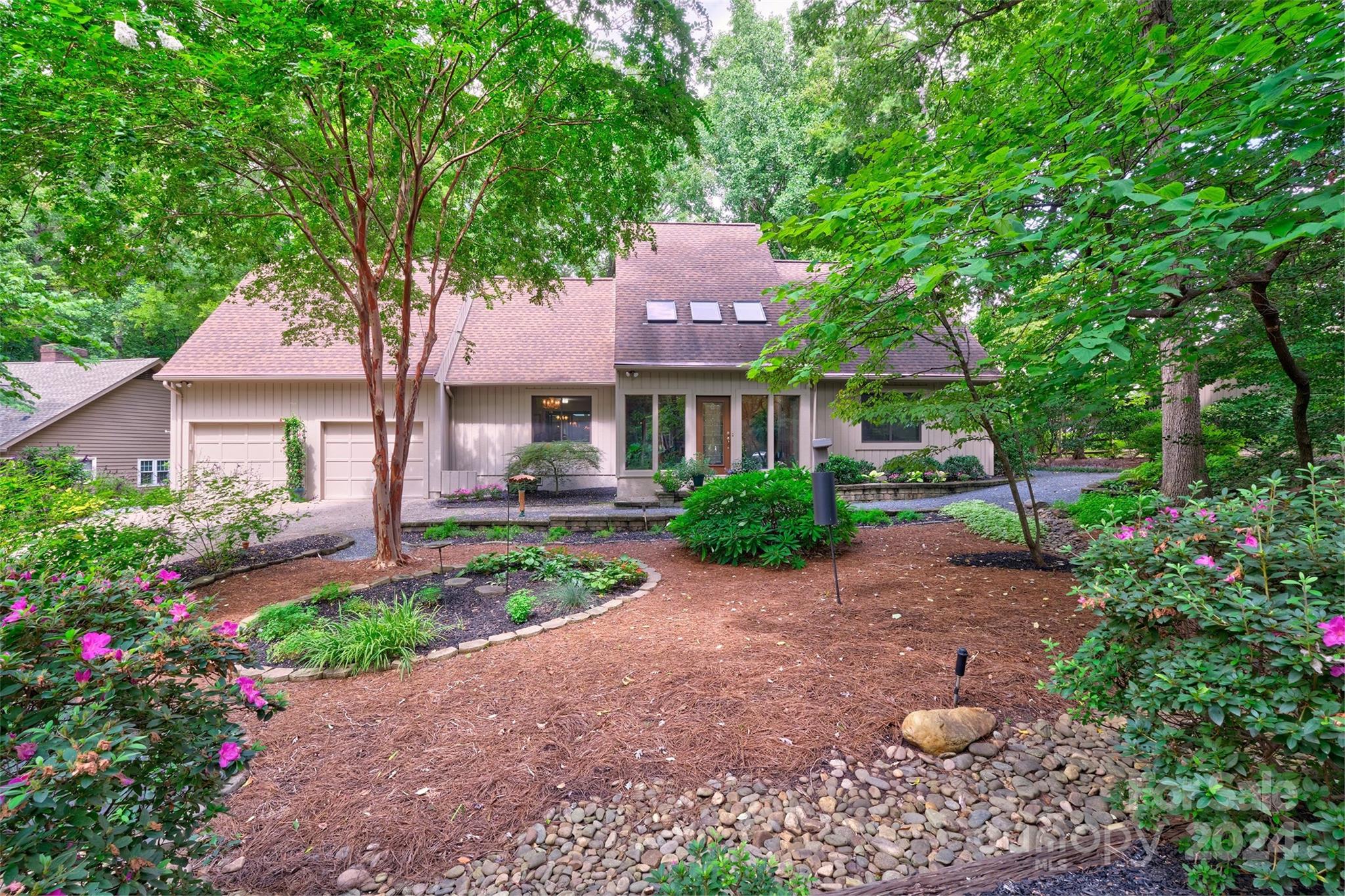 a front view of a house with garden