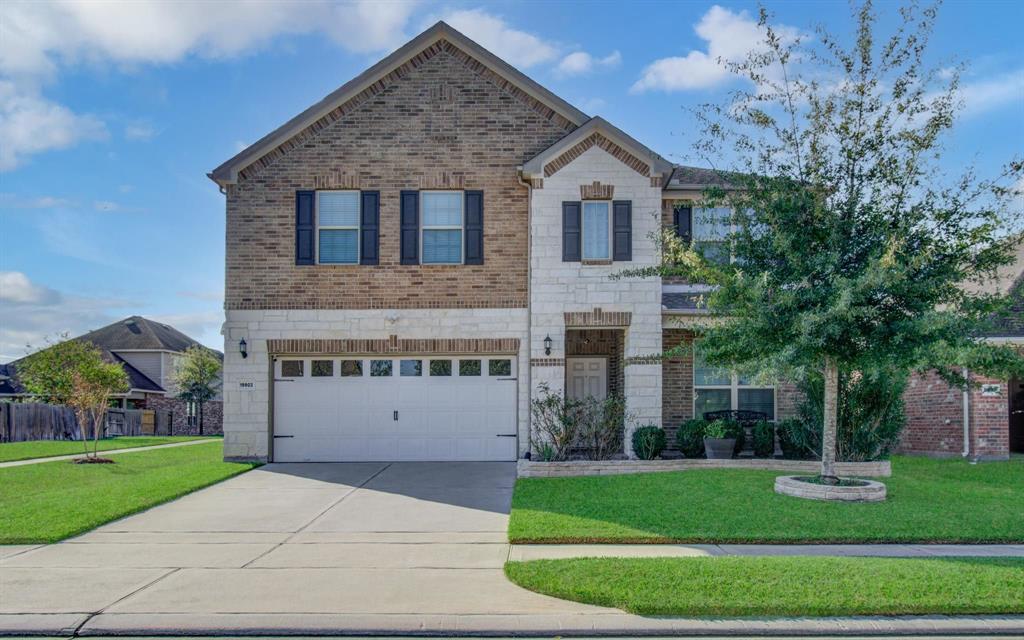 Stunning super well maintained upgraded stone / vibrant clay-brick front elevation includes a front covered porch elongated driveway and NO neighbors to the right as the home is nestled on a cornered greenbelt, great privacy and just super nice.