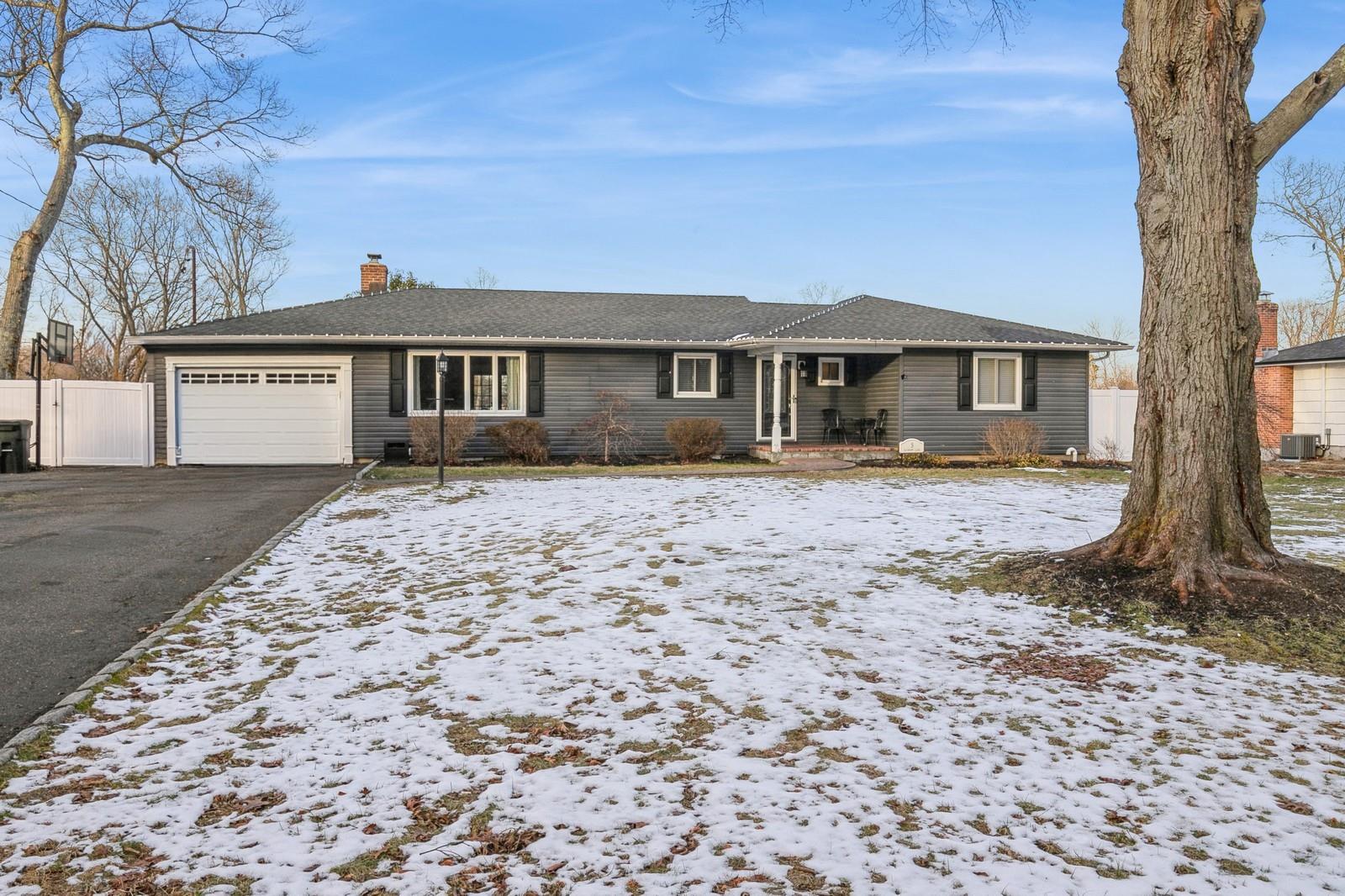 Single story home with central AC and a garage