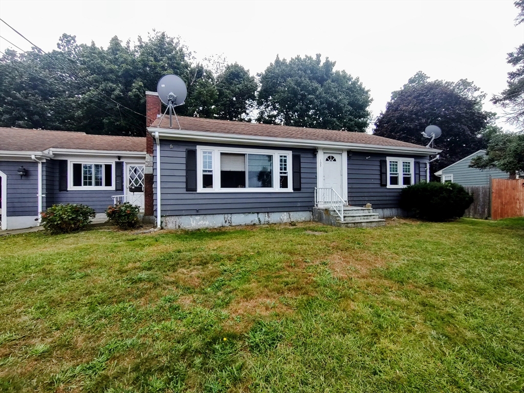 front view of a house with a yard