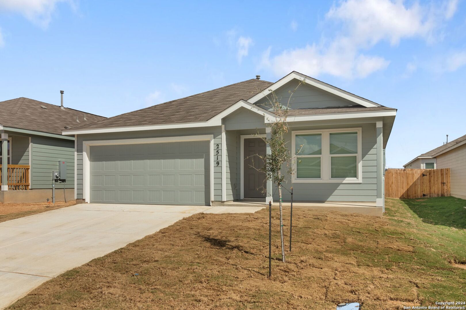 a front view of a house with a garage