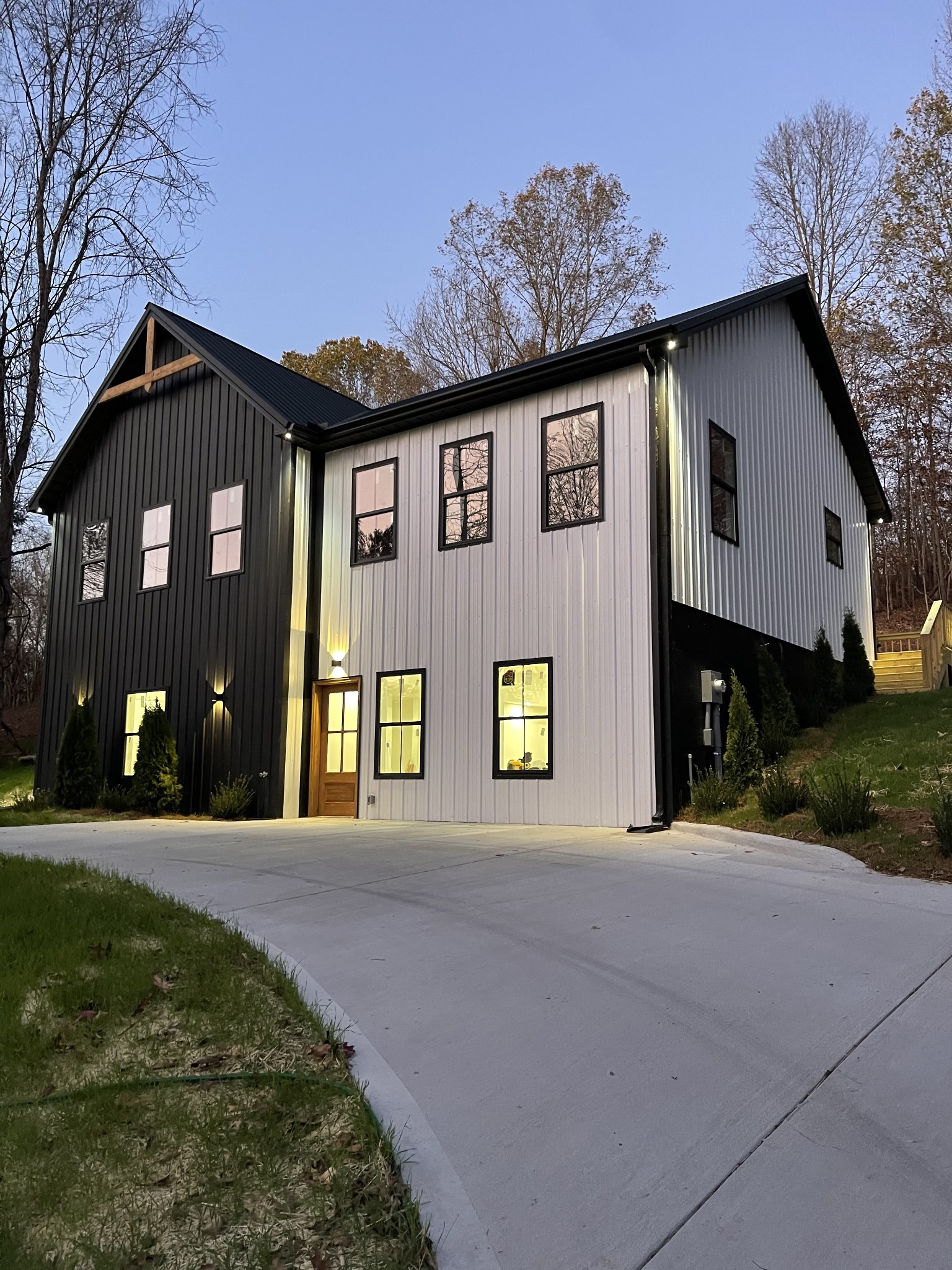 a front view of a house with a garden