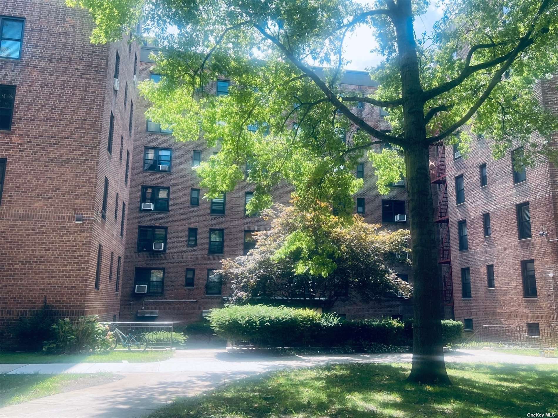 a view of a building with a yard