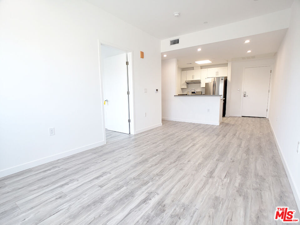 a view of kitchen with wooden floor