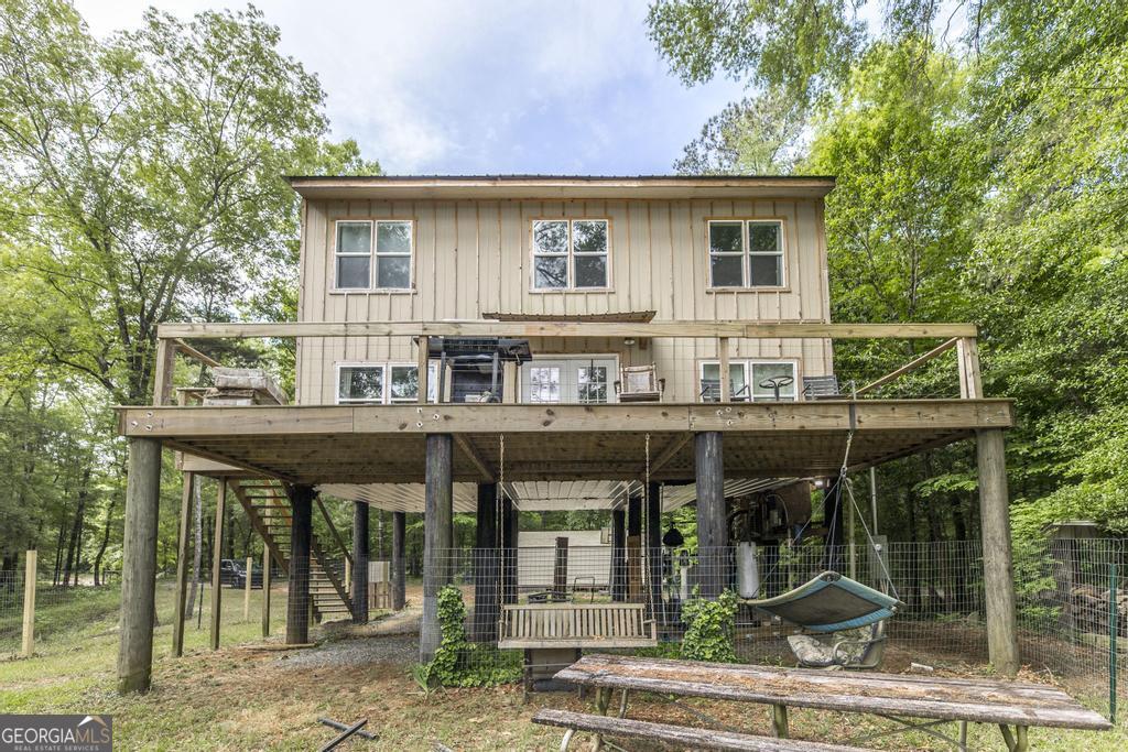 a view of a house with porch and outdoor seating