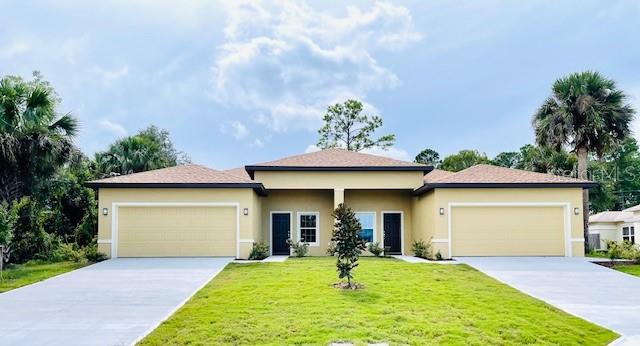 a view of a house with backyard and porch