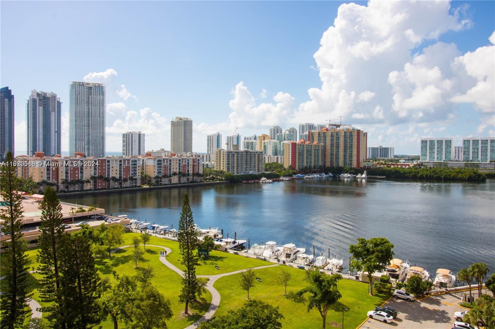 a view of a city with a lake