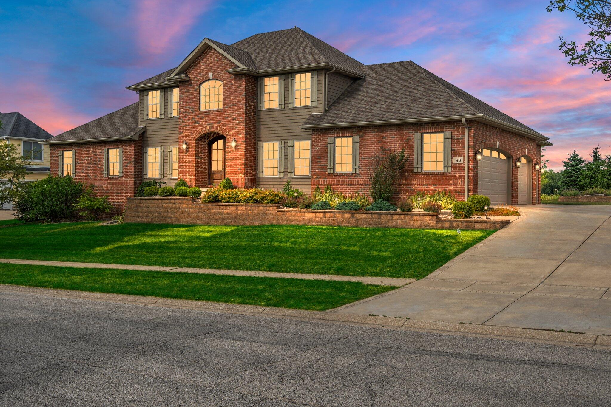 a front view of a house with a yard