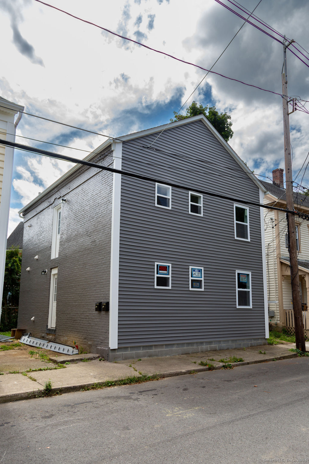 a view of a house with a street