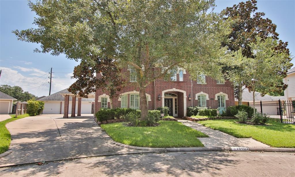 3 car garage with 15 ft extension, port cochere, and long driveway