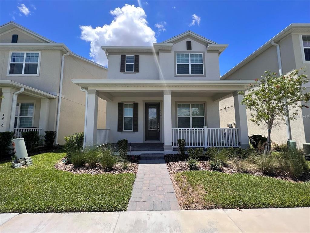 a front view of a house with garden