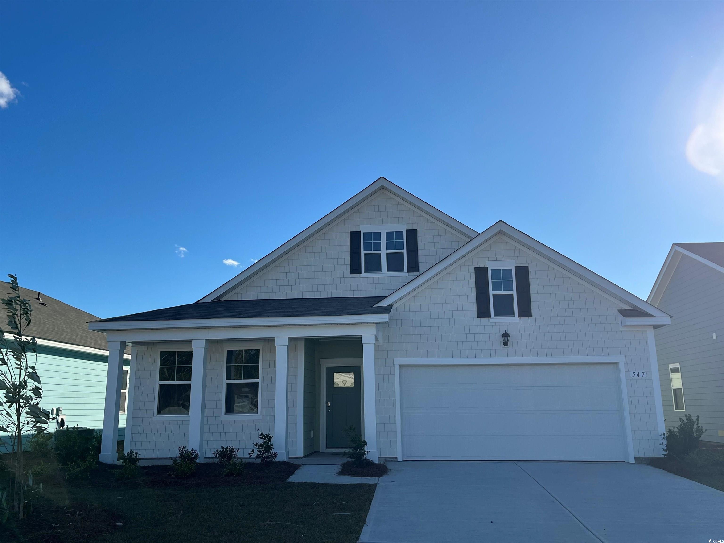 View of front facade with a garage