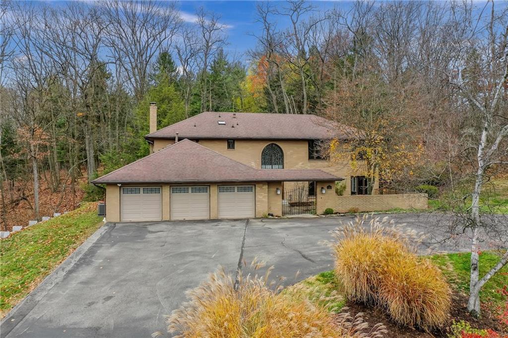 a house with trees in the background