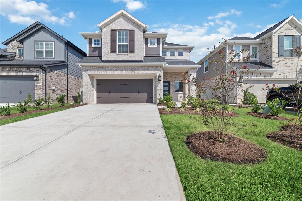 a view of house with yard and entertaining space