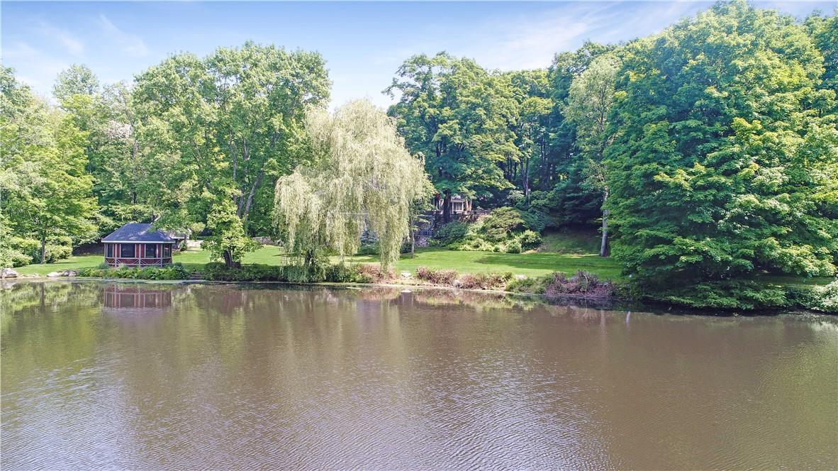 a view of a lake with a building in the background