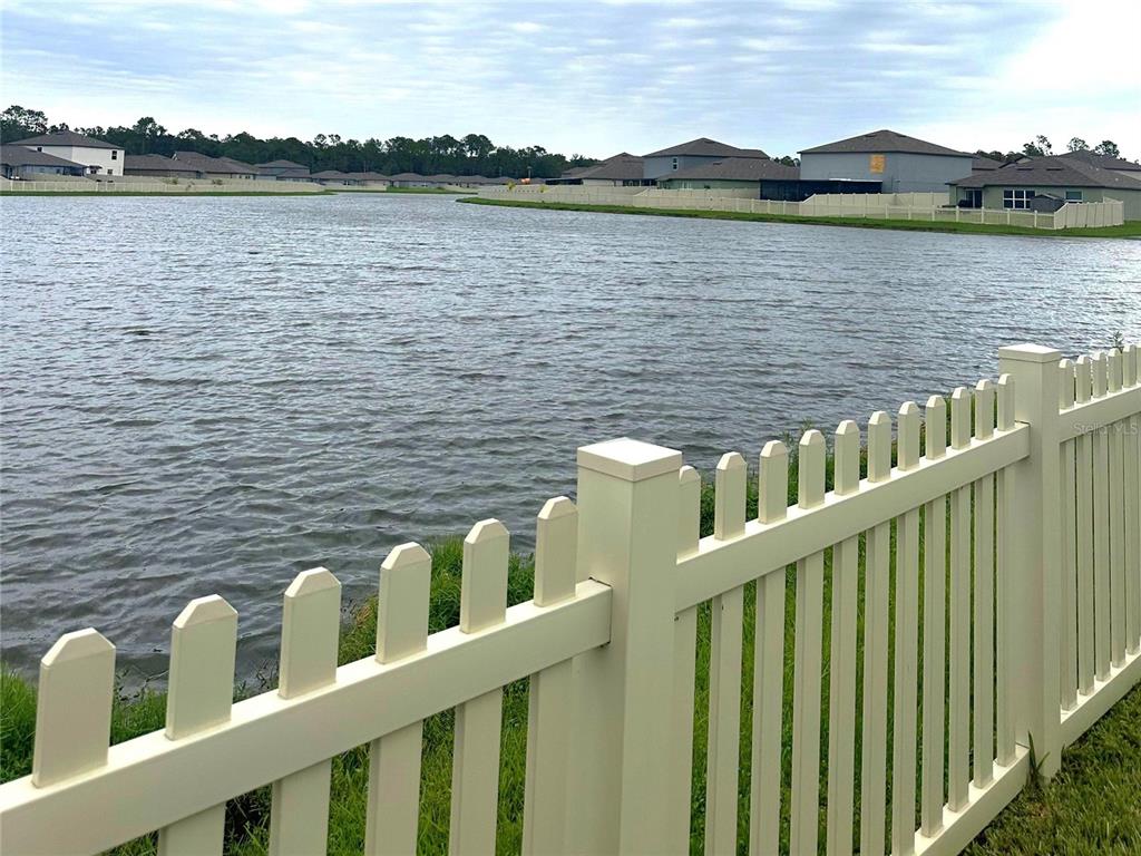 a view of a wooden deck and lake