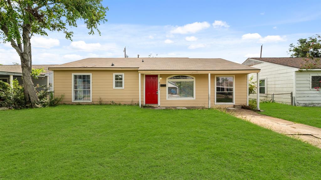 front view of a house and a yard