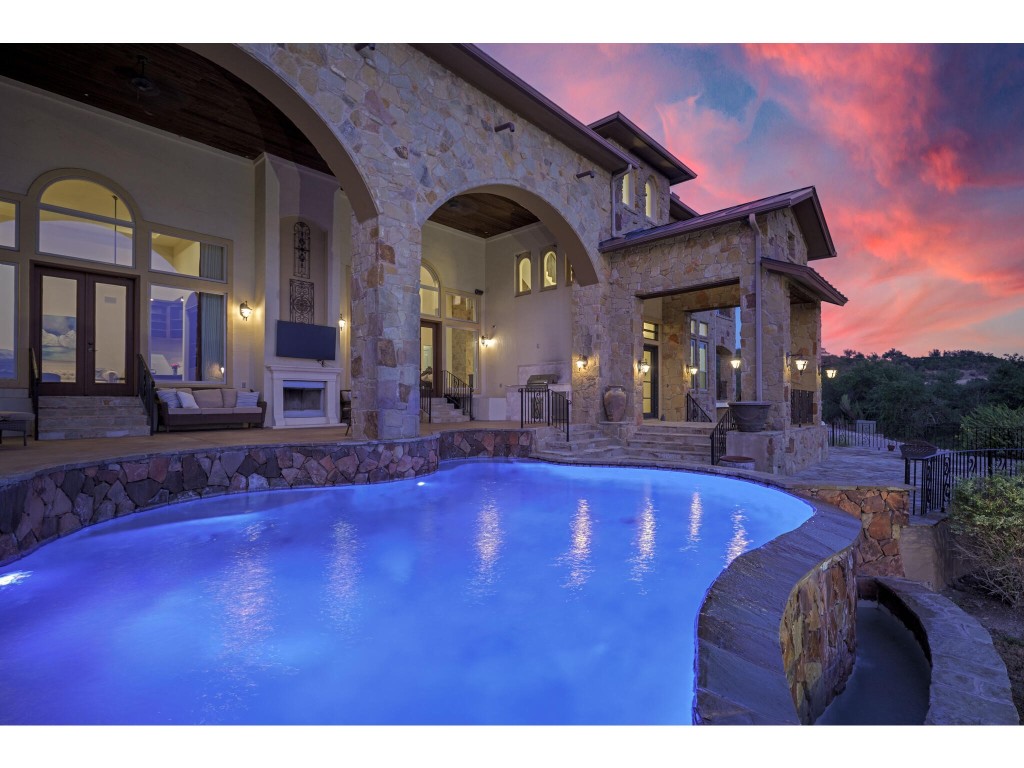 a view of swimming pool with outdoor seating