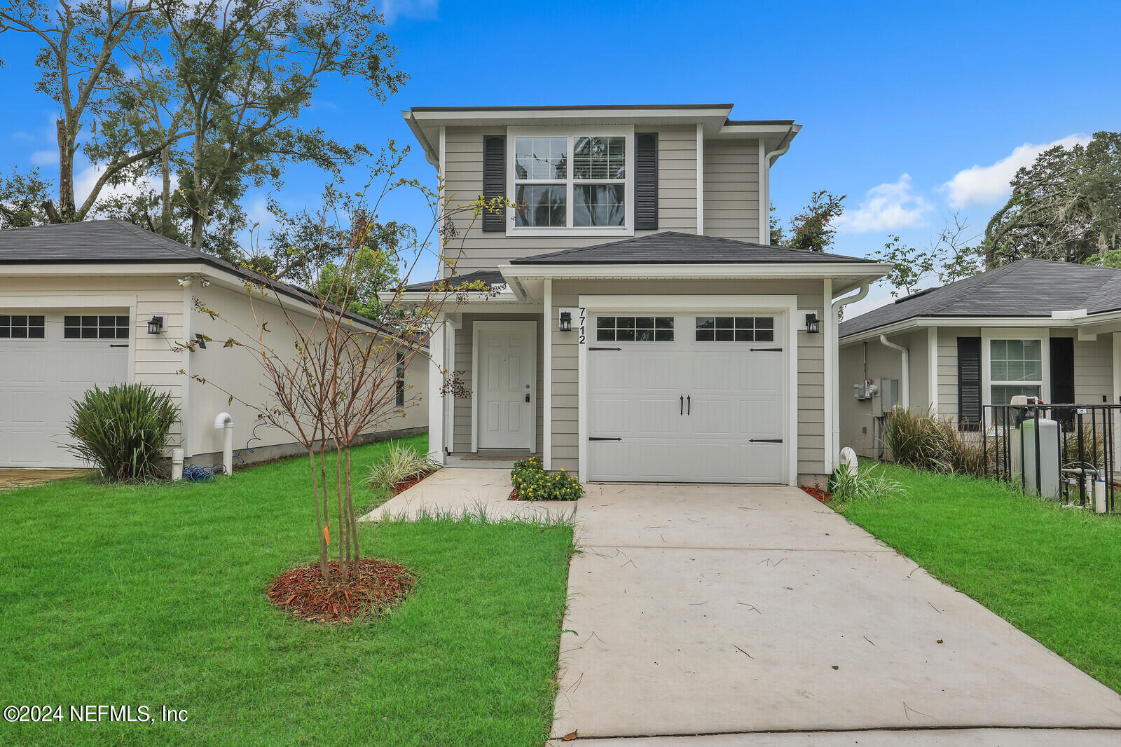 front view of a house with a yard