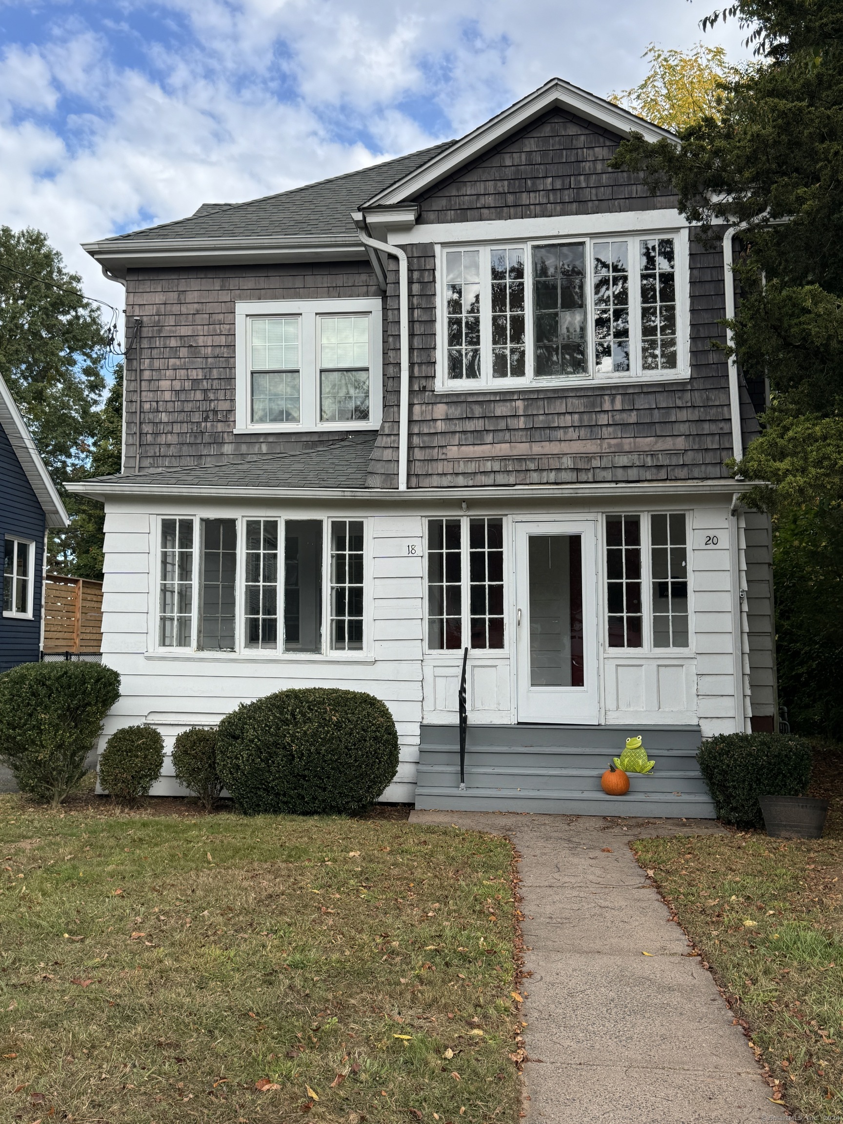 a front view of a house with a yard