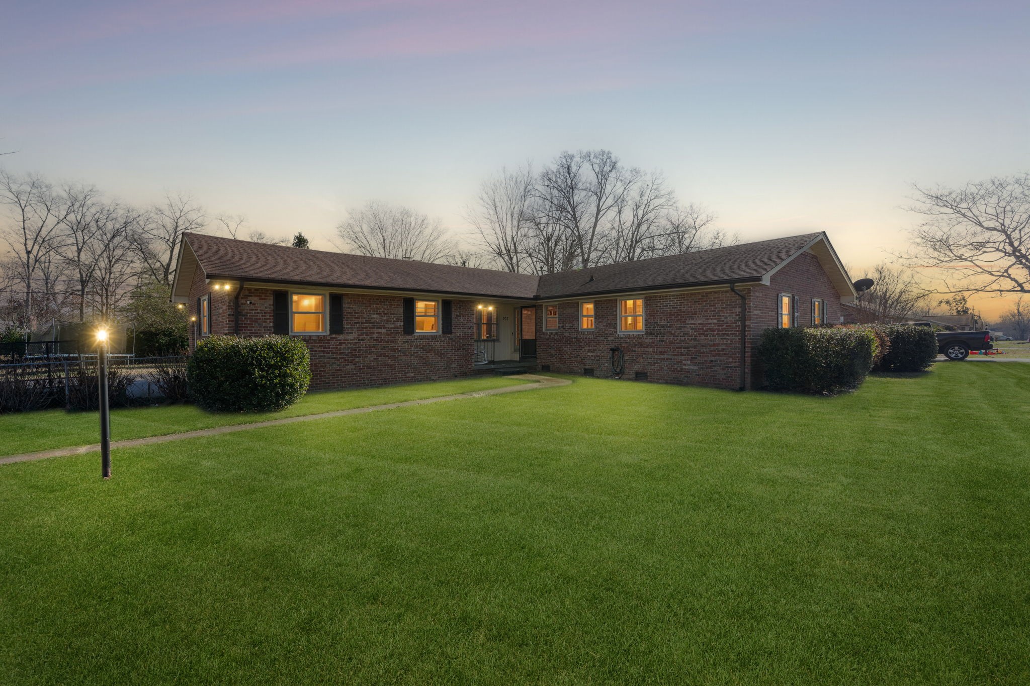 a front view of a house with a garden