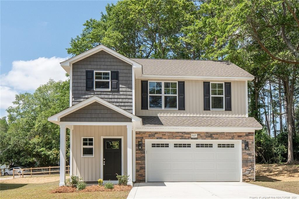 a view of a house with a yard