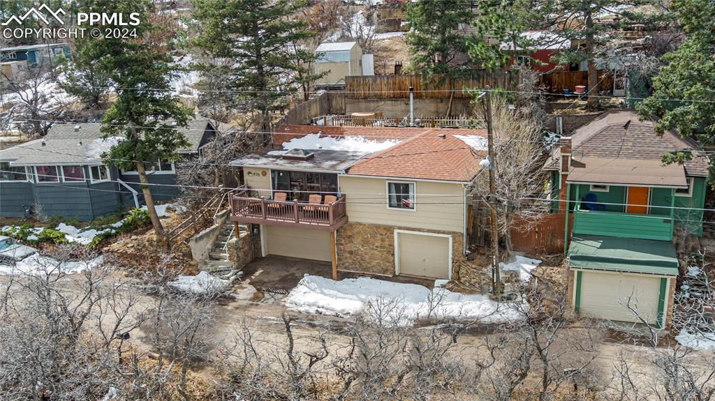 a aerial view of a house with a yard