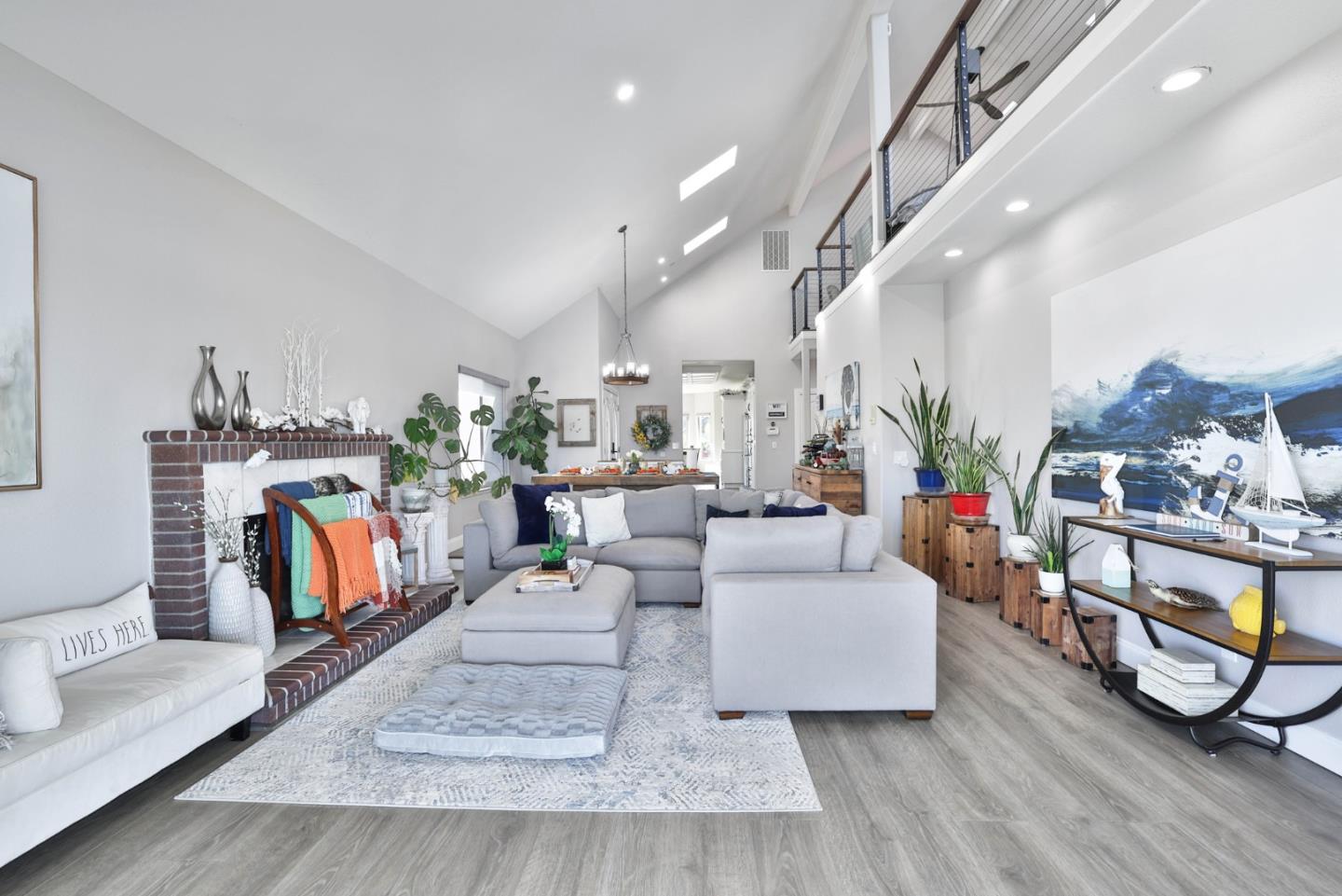 a living room with fireplace furniture and a wooden floor