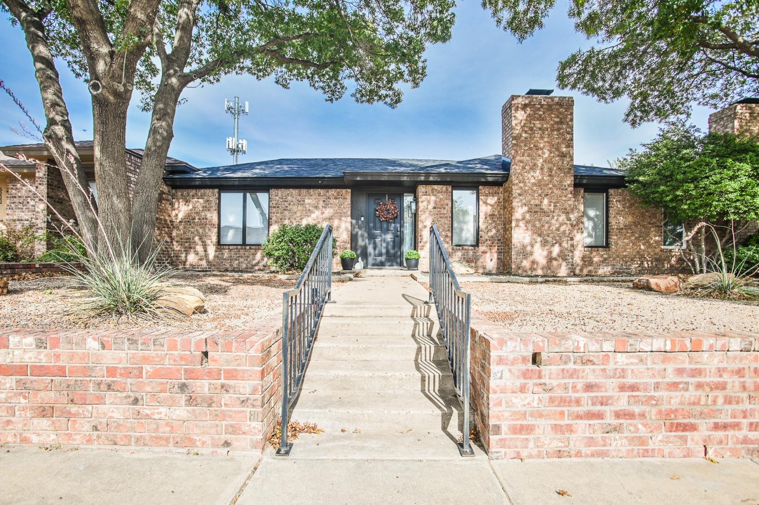 a view of a building with a tree