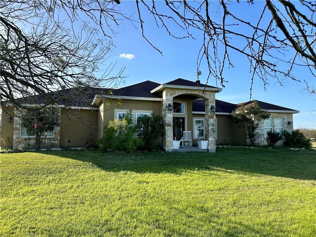 a view of a house with a yard