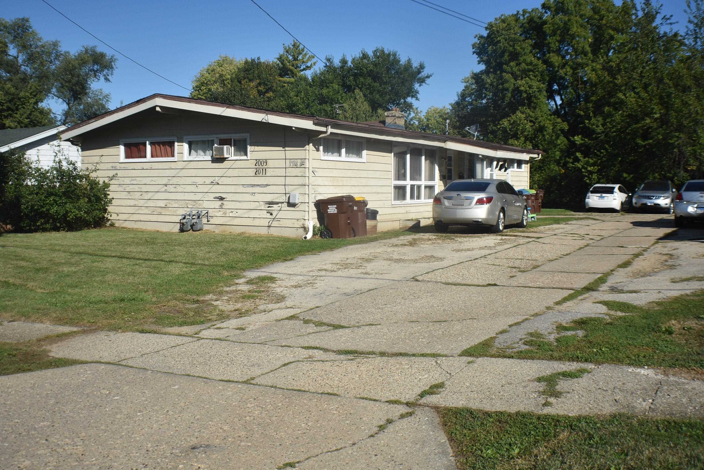 a front view of a house with yard