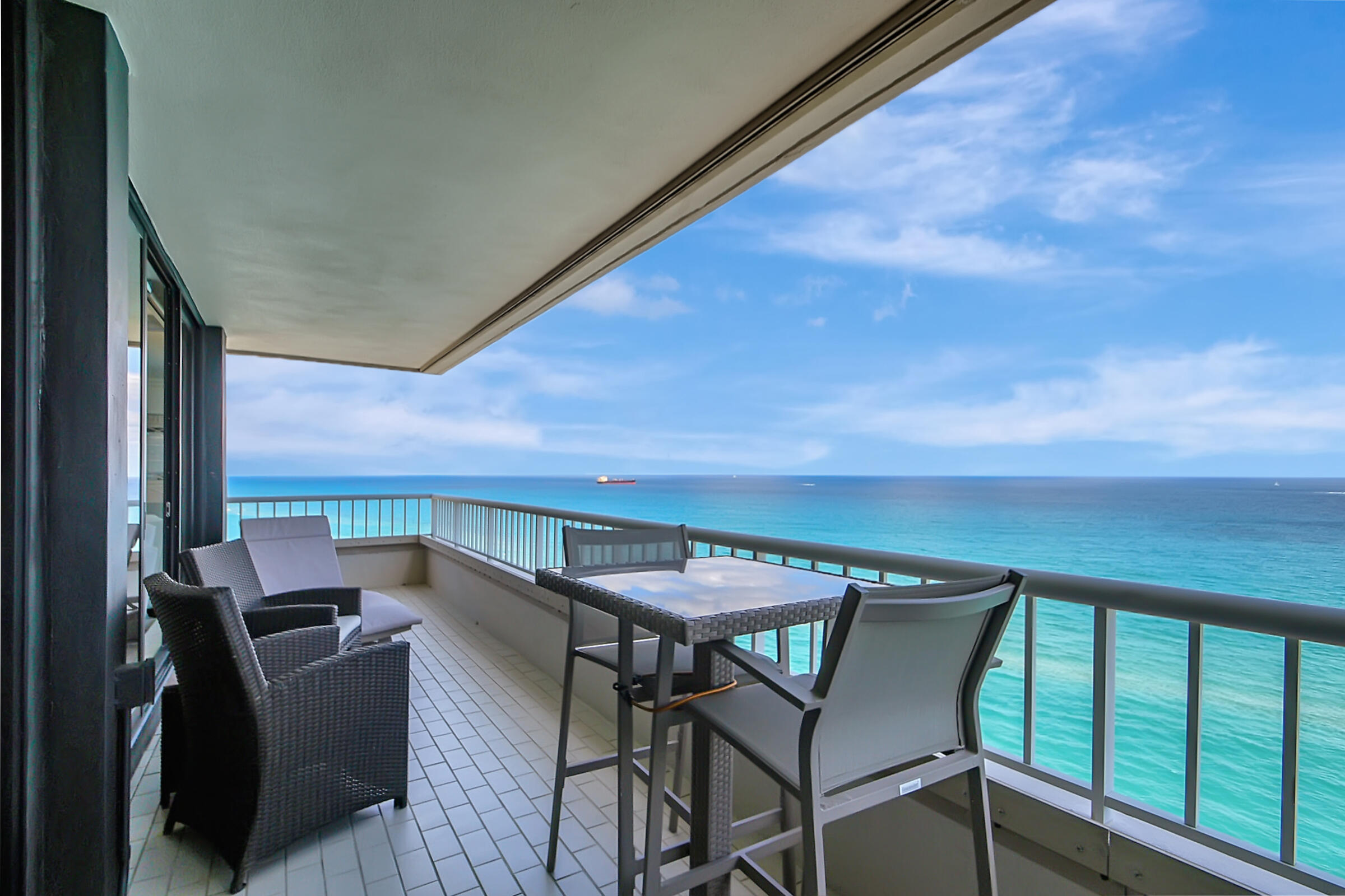 a balcony with furniture and city view