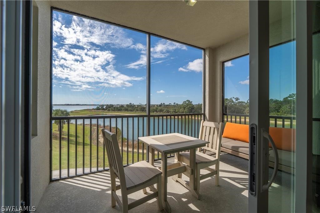 a view of a balcony with chair and table in the balcony