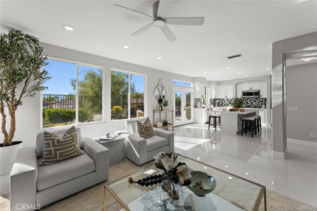 a living room with furniture and a large window