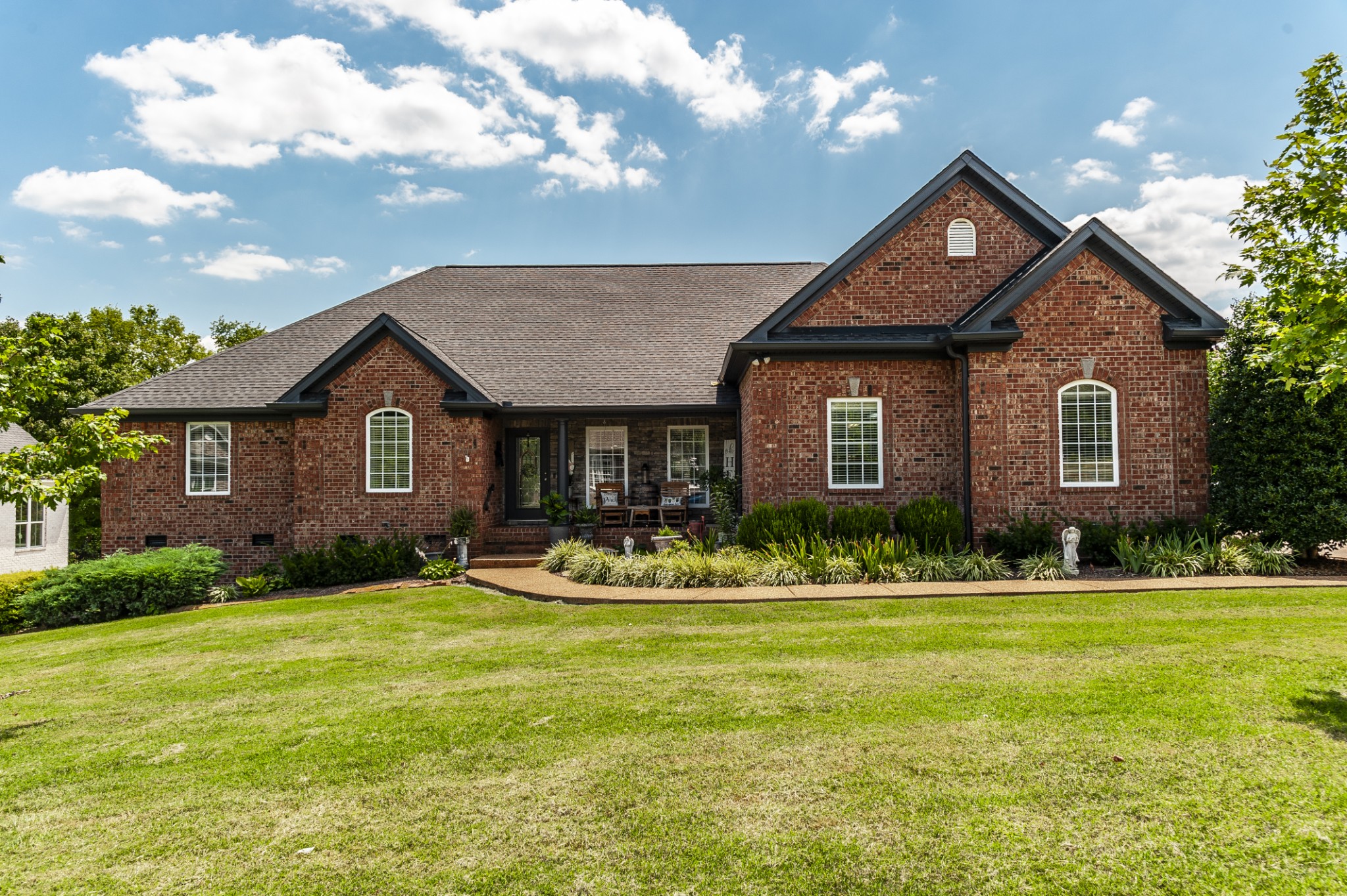 a front view of a house with a yard