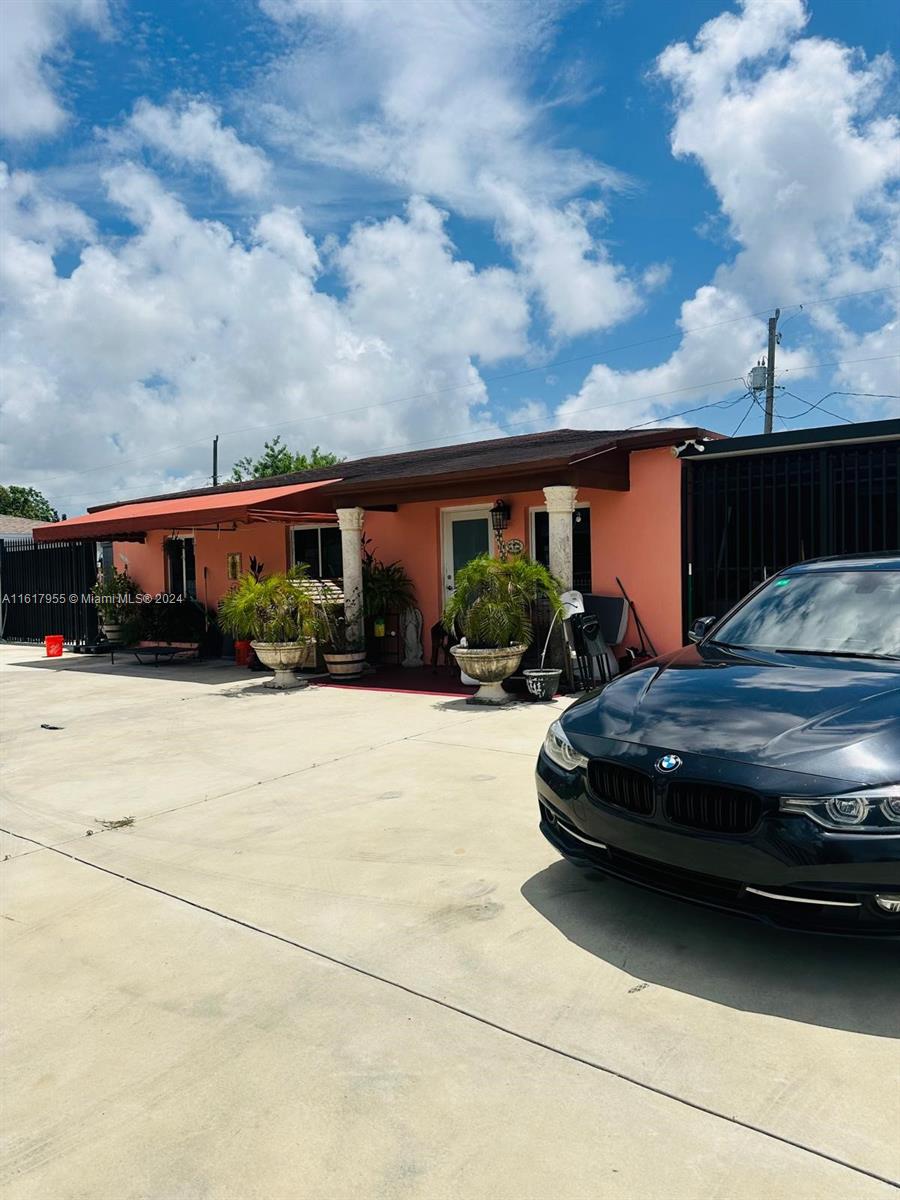 a view of car parked in front of house