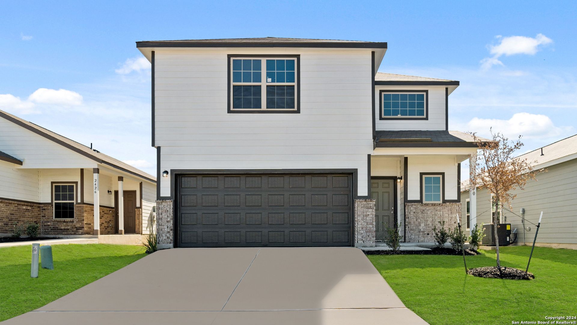 a front view of a house with a yard