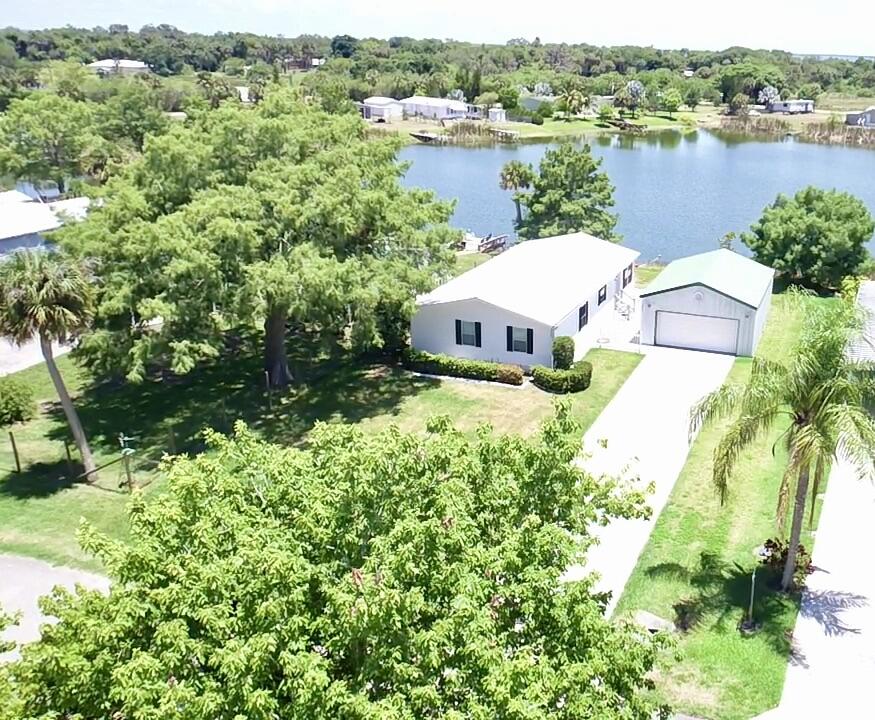 a view of a lake with a house in the background