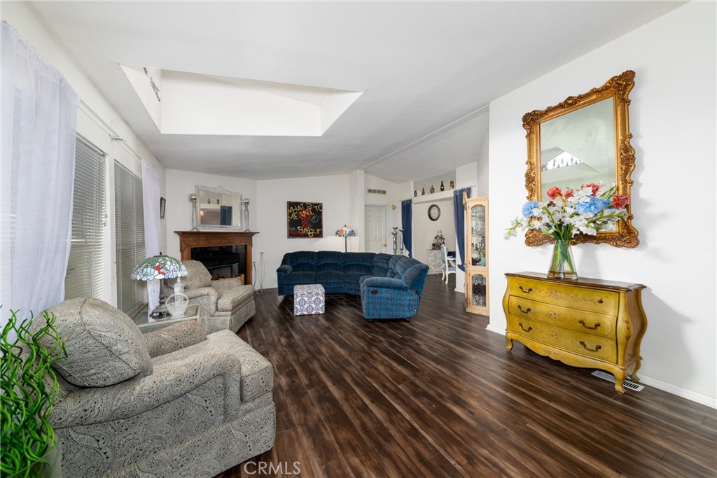 a living room with fireplace furniture and a flat screen tv