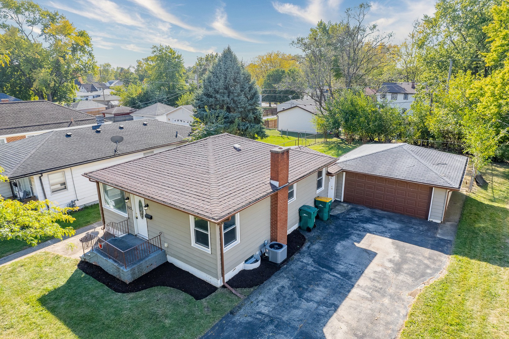 a aerial view of a house with swimming pool next to a yard