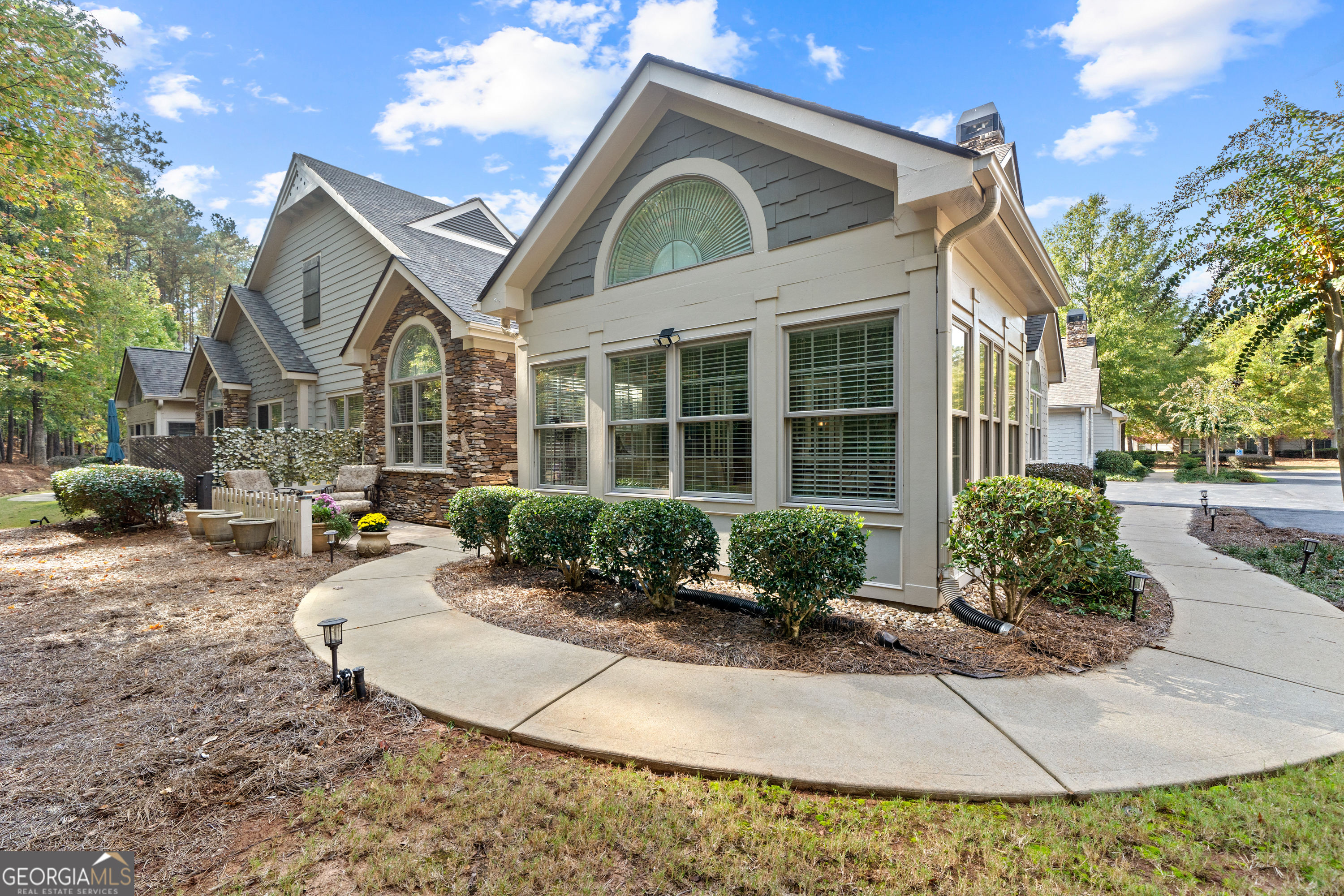 a front view of a house with garden