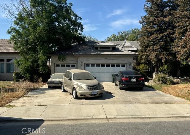 a view of a cars park in front of house