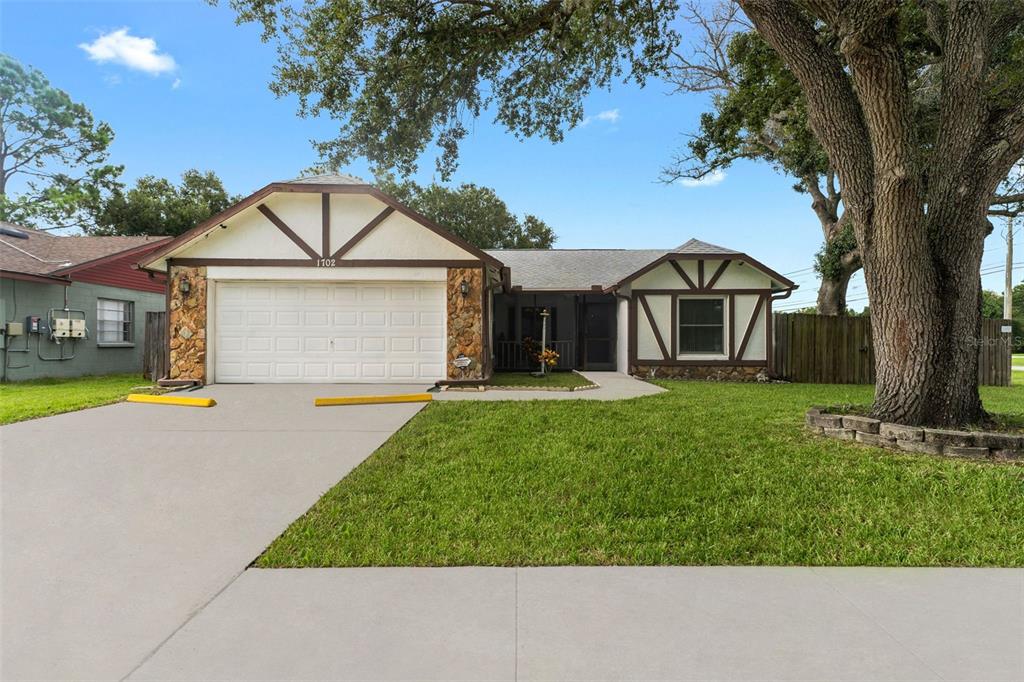 front view of a house with a yard